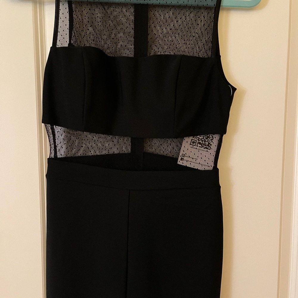 Formal black dress, with sheer/ polka dot detailing.